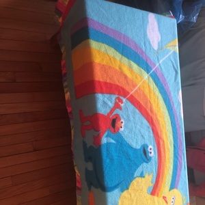 Sesame Street rainbow blanket.